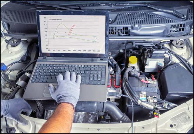 Mechanic inspecting engine components
